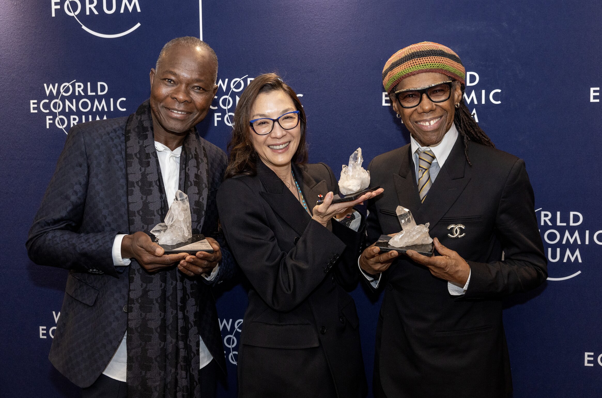L-R: Francis Kéré, Michelle Yeoh, and Nile Rodgers receive their Crystal Awards on January 15